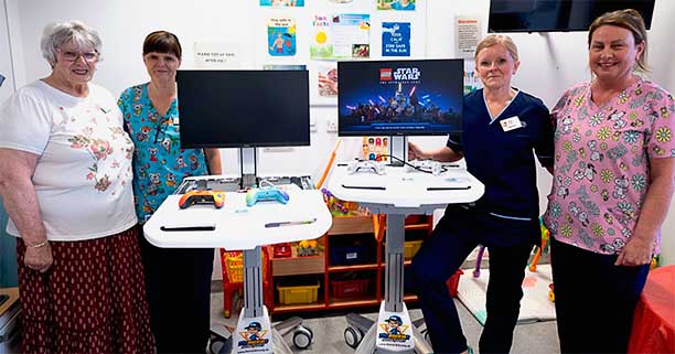 Heather Ogg,(Chair),(on left) with staff from the Children’s Ward following the delivery of the Gaming Stations funded by the Friends
